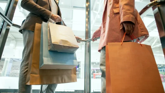 couple-carrying-bunch-of-paperbags-2026-01-08-23-44-00-utc