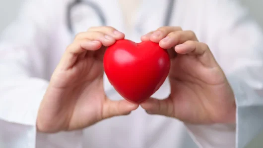 doctor-hand-holding-red-heart-shape-in-hospital-2026-01-08-06-42-21-utc