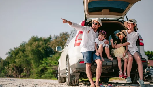 happy-asian-family-enjoying-road-trip-with-their-f-2023-11-27-05-36-55-utc