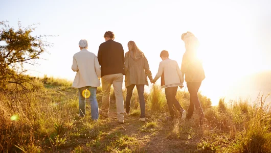 rearview-shot-of-a-multi-generational-family-walki-2023-11-27-05-10-38-utc