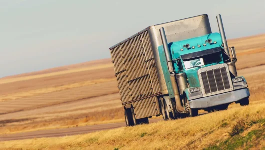 semi-truck-on-prairie-road-2021-08-26-23-04-20-utc-scaled