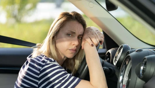 sleepy-woman-driver-bored-in-traffic-jam-on-seat-l-2022-01-28-02-19-20-utc-scaled