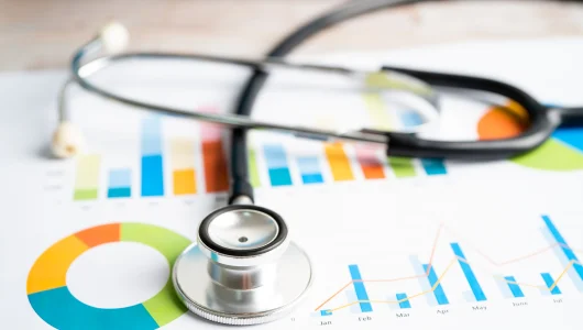 stethoscope-on-charts-and-graphs-paper-finance-a-2024-09-18-20-37-41-utc